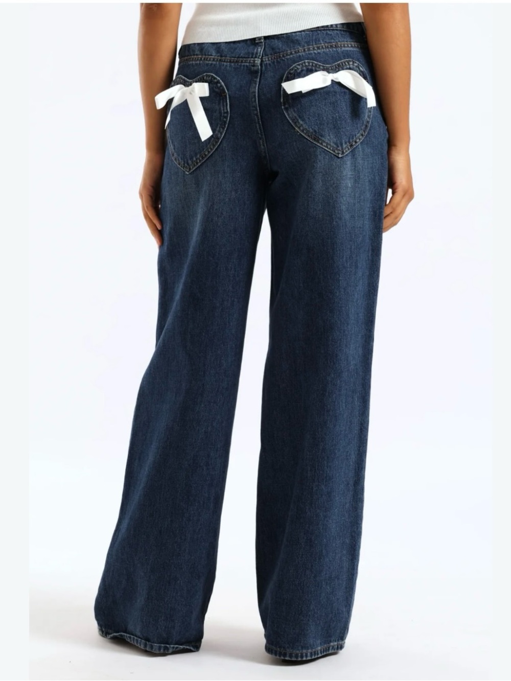 Forever 21 blue denim jeans with heart-shaped pockets white bows